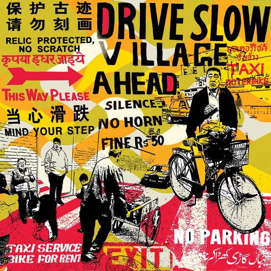 DRIVE SLOW VILLAGE AHEAD